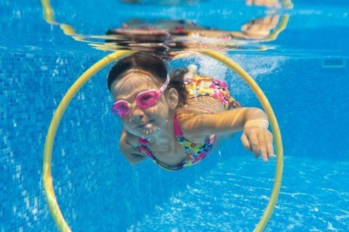11753742-happy-smiling-underwater-child-in-swimming-pool-little-girl-swims-kids-sport